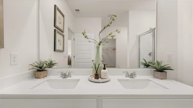 a bedroom with a bed potted plant and a window