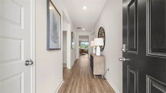 a view of a bathroom from a hallway