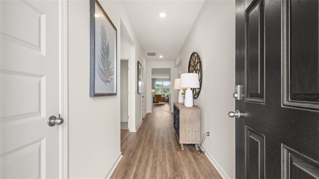 207 Cattle Drive Perry, GA 31069 - Photo 28 of 52 a view of a hallway with wooden floor and furniture