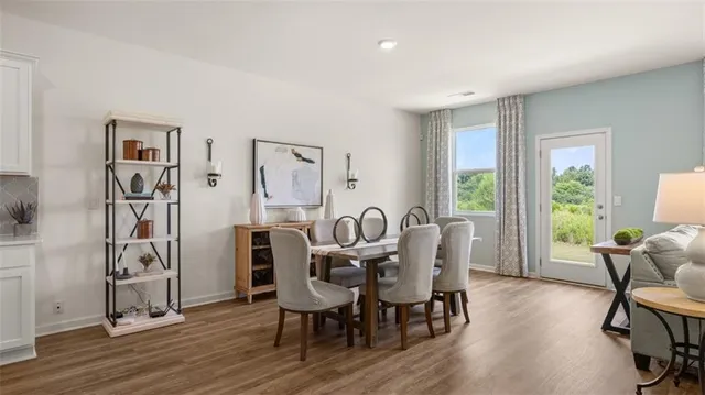 a view of a livingroom with furniture window and wooden floor