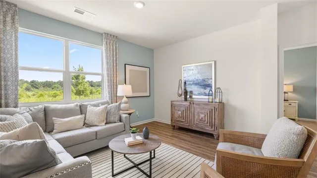 a bed room with a bed and a large window