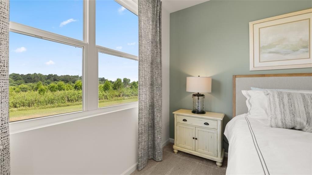 207 Cattle Drive Perry, GA 31069 - Photo 37 of 52 a bed room with a bed and a large window