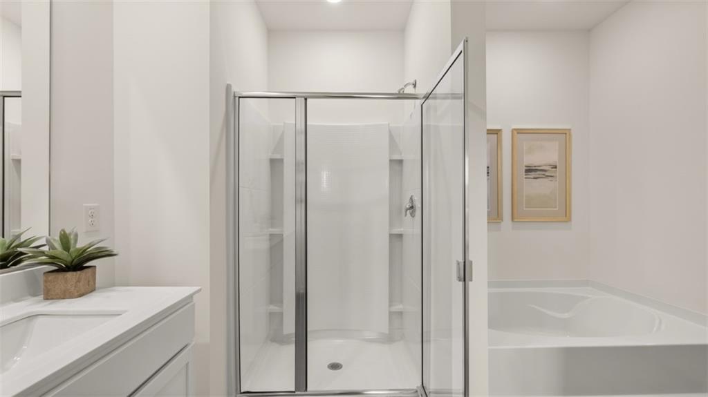 207 Cattle Drive Perry, GA 31069 - Photo 39 of 52 a bathroom with a shower a sink and a mirror