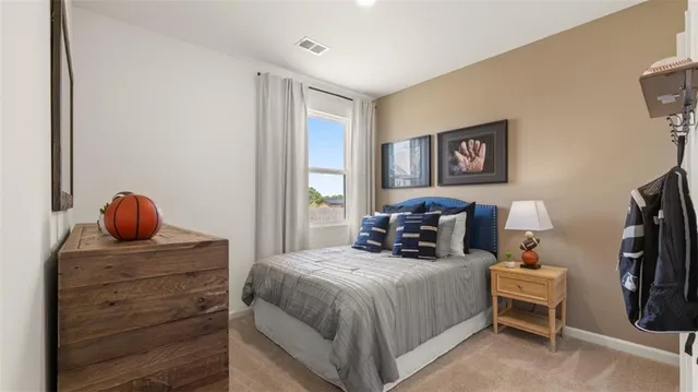 a bedroom with a bed and a mirror