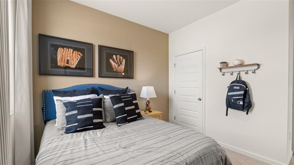 207 Cattle Drive Perry, GA 31069 - Photo 46 of 52 a bedroom with a bed and a table