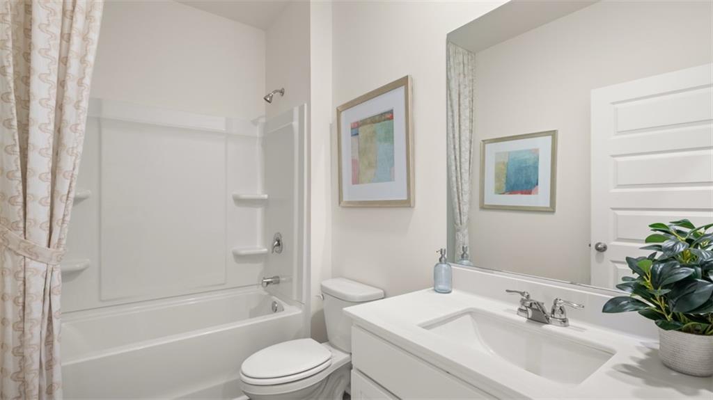 207 Cattle Drive Perry, GA 31069 - Photo 50 of 52 a bathroom with a sink toilet and a bathtub