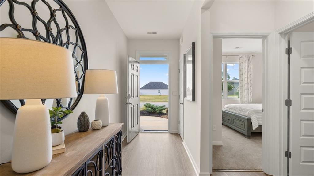207 Cattle Drive Perry, GA 31069 - Photo 7 of 52 a en suite bathroom with a granite countertop sink and a mirror
