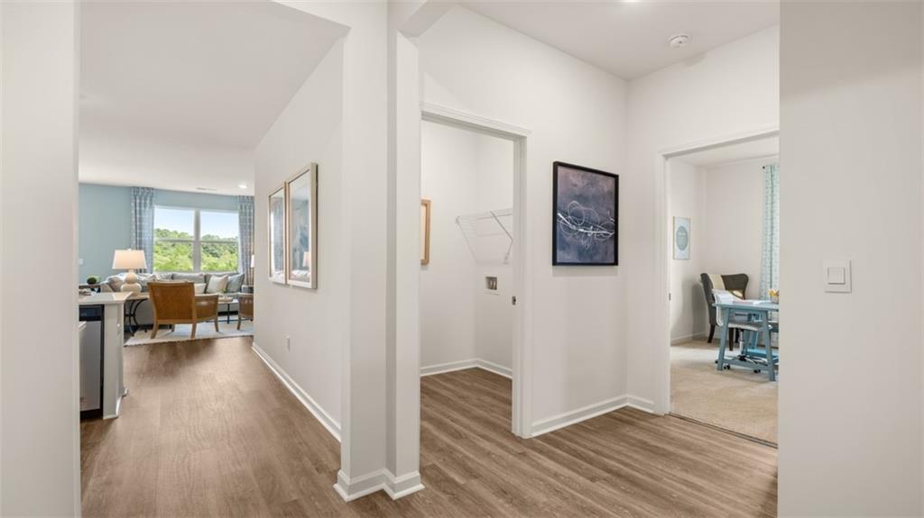 207 Cattle Drive Perry, GA 31069 - Photo 8 of 52 a view of a hallway with wooden floor fireplace and living room