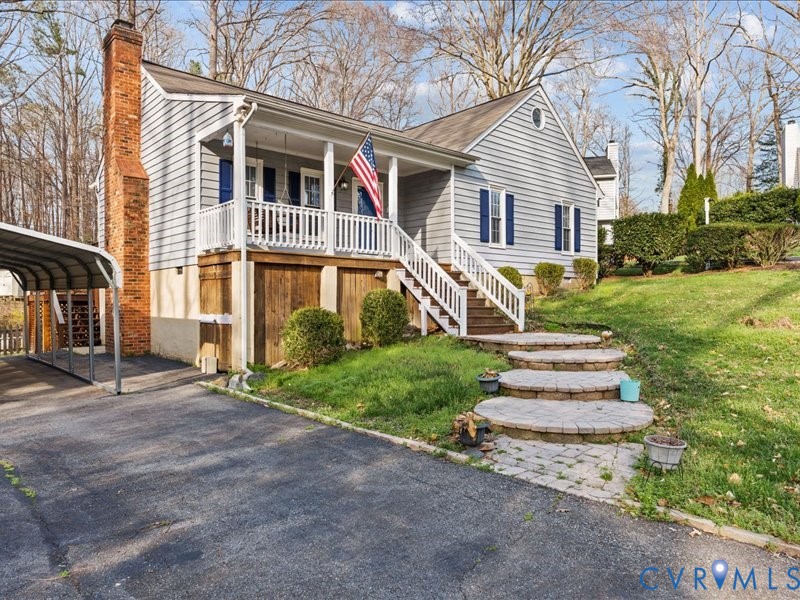 11906 Lockett Ridge Place Midlothian, VA 23114 - Photo 3 of 20 View of front facade with a chimney, covered porch