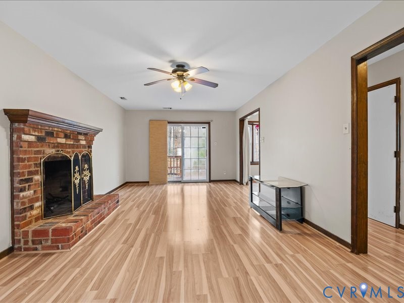11906 Lockett Ridge Place Midlothian, VA 23114 - Photo 5 of 20 Unfurnished living room featuring light wood finis