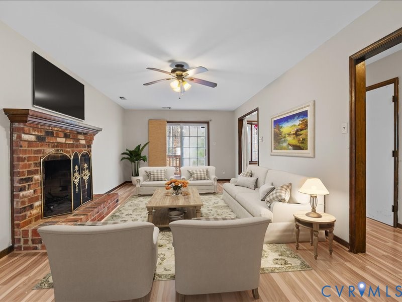 11906 Lockett Ridge Place Midlothian, VA 23114 - Photo 6 of 20 Living room featuring light wood-type flooring, a