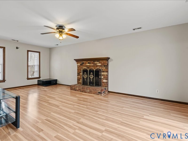 11906 Lockett Ridge Place Midlothian, VA 23114 - Photo 7 of 20 Unfurnished living room with light wood finished f