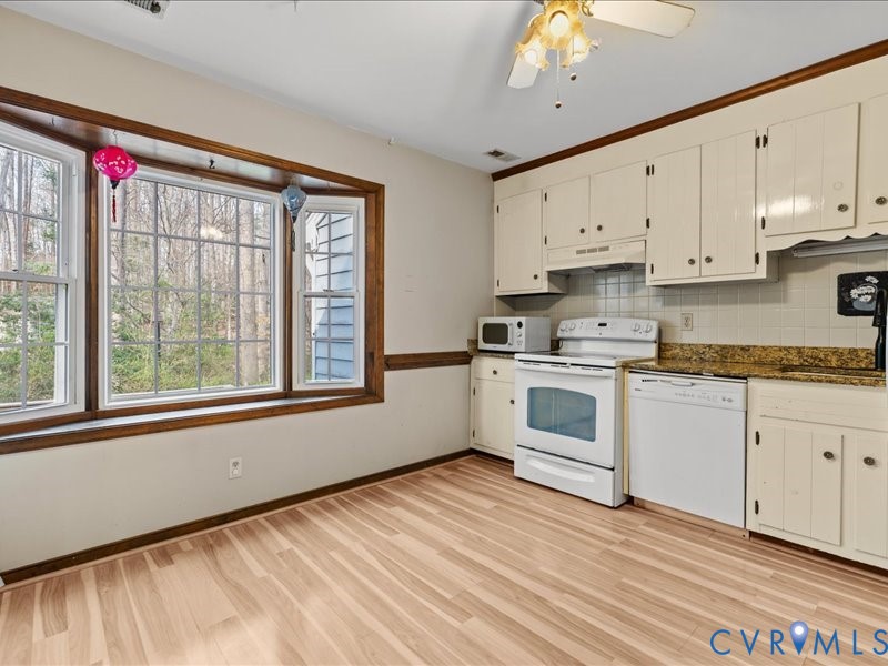 11906 Lockett Ridge Place Midlothian, VA 23114 - Photo 8 of 20 Kitchen featuring white appliances, light wood fin