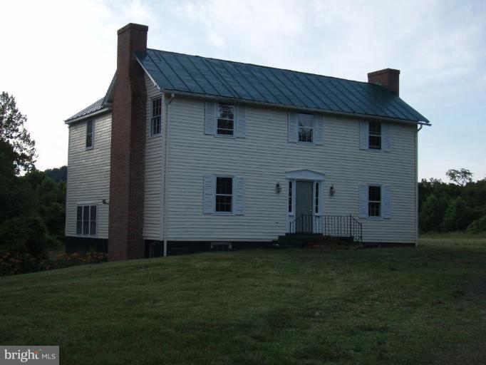 487 Rudasill Mill Road Woodville, VA 22749 - Photo 2 of 30 a front view of a house with a garden