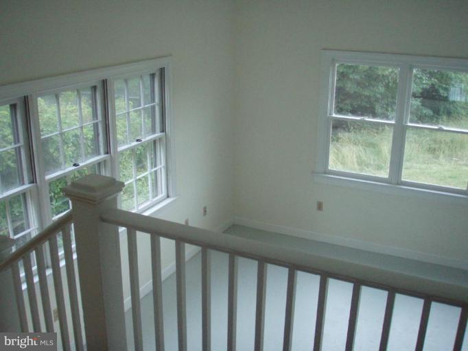 487 Rudasill Mill Road Woodville, VA 22749 - Photo 20 of 30 a view of porch with wooden floor and windows
