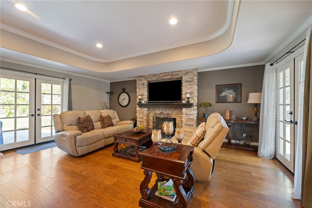 10588 Silver Spur Court Rancho Cucamonga, CA 91737 - Photo 23 of 63 a living room with furniture and a flat screen tv
