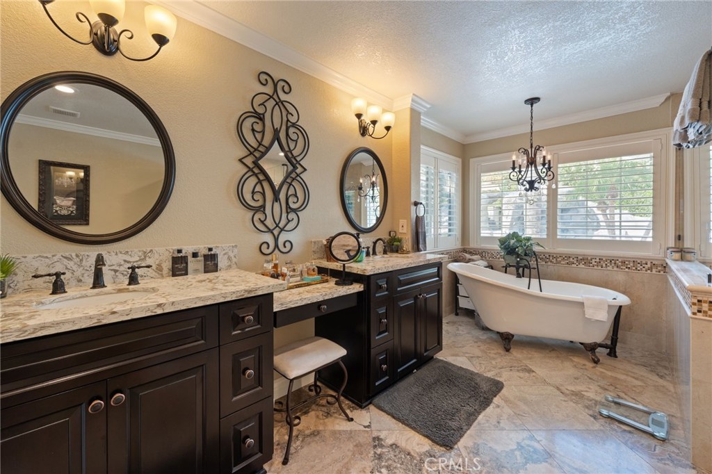 10588 Silver Spur Court Rancho Cucamonga, CA 91737 - Photo 34 of 63 a bathroom with a double vanity sink and a mirror