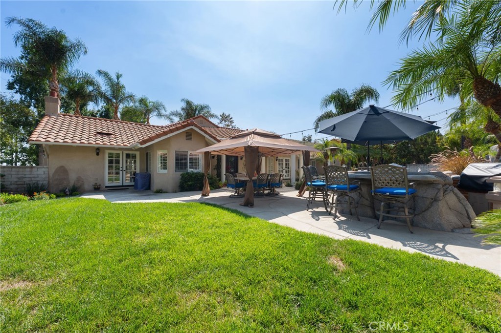 10588 Silver Spur Court Rancho Cucamonga, CA 91737 - Photo 49 of 63 a view of a house with a yard and sitting area