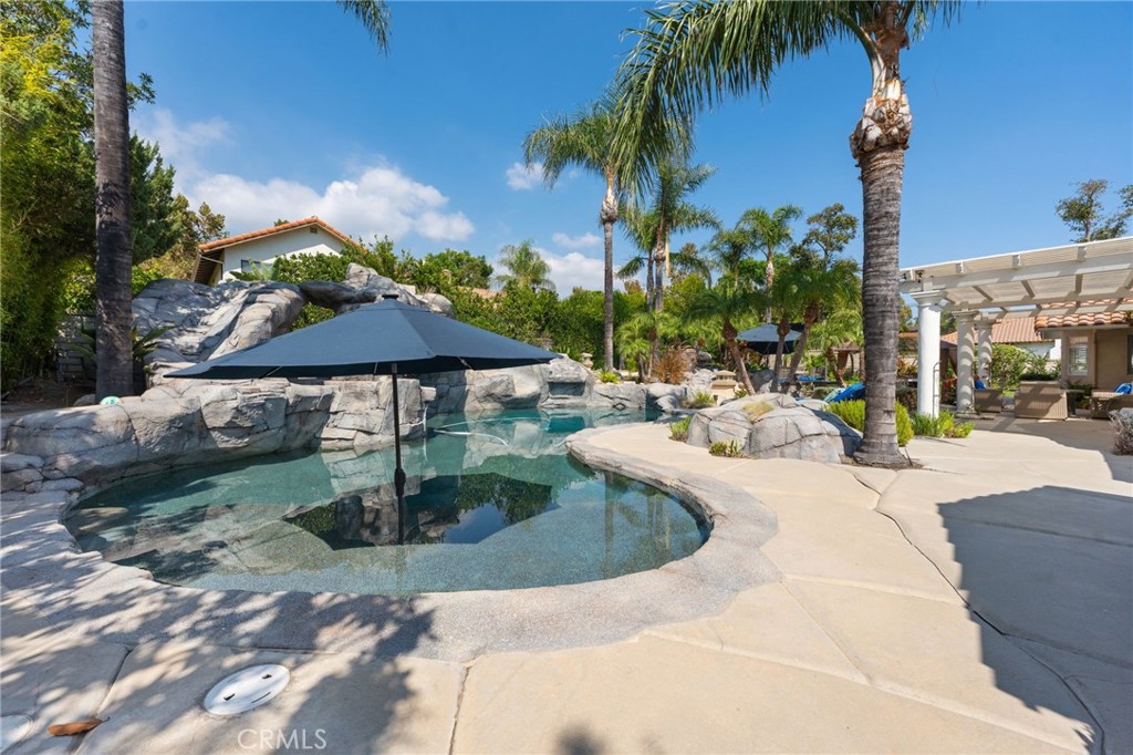 10588 Silver Spur Court Rancho Cucamonga, CA 91737 - Photo 53 of 63 a view of a patio with swimming pool