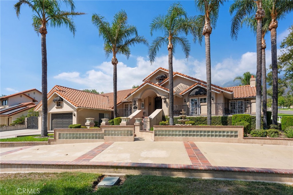 10588 Silver Spur Court Rancho Cucamonga, CA 91737 - Photo 8 of 63 a front view of a house with a yard