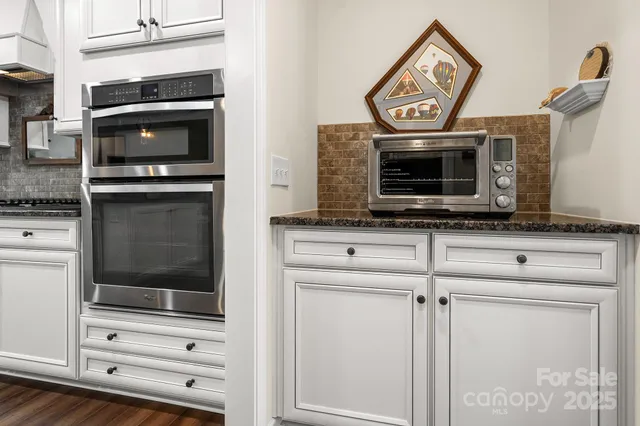 a kitchen with a stove and a microwave