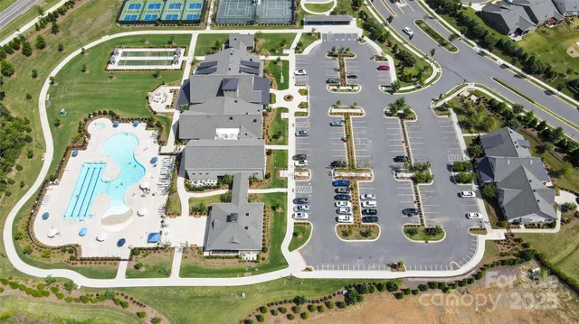 an aerial view of residential house with outdoor space and swimming pool
