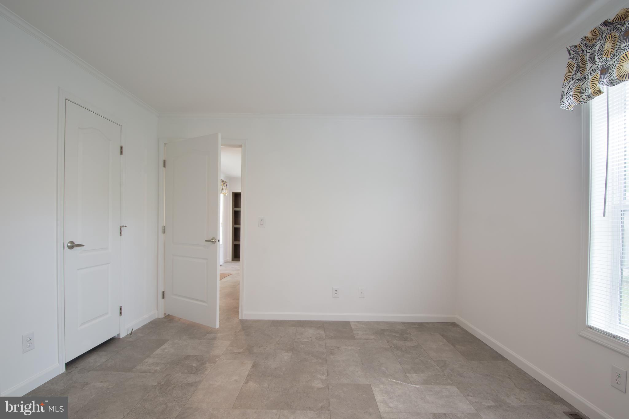 68 Friars Lane, Unit 68 Hartly, DE 19953 - Photo 16 of 18 an empty room with windows