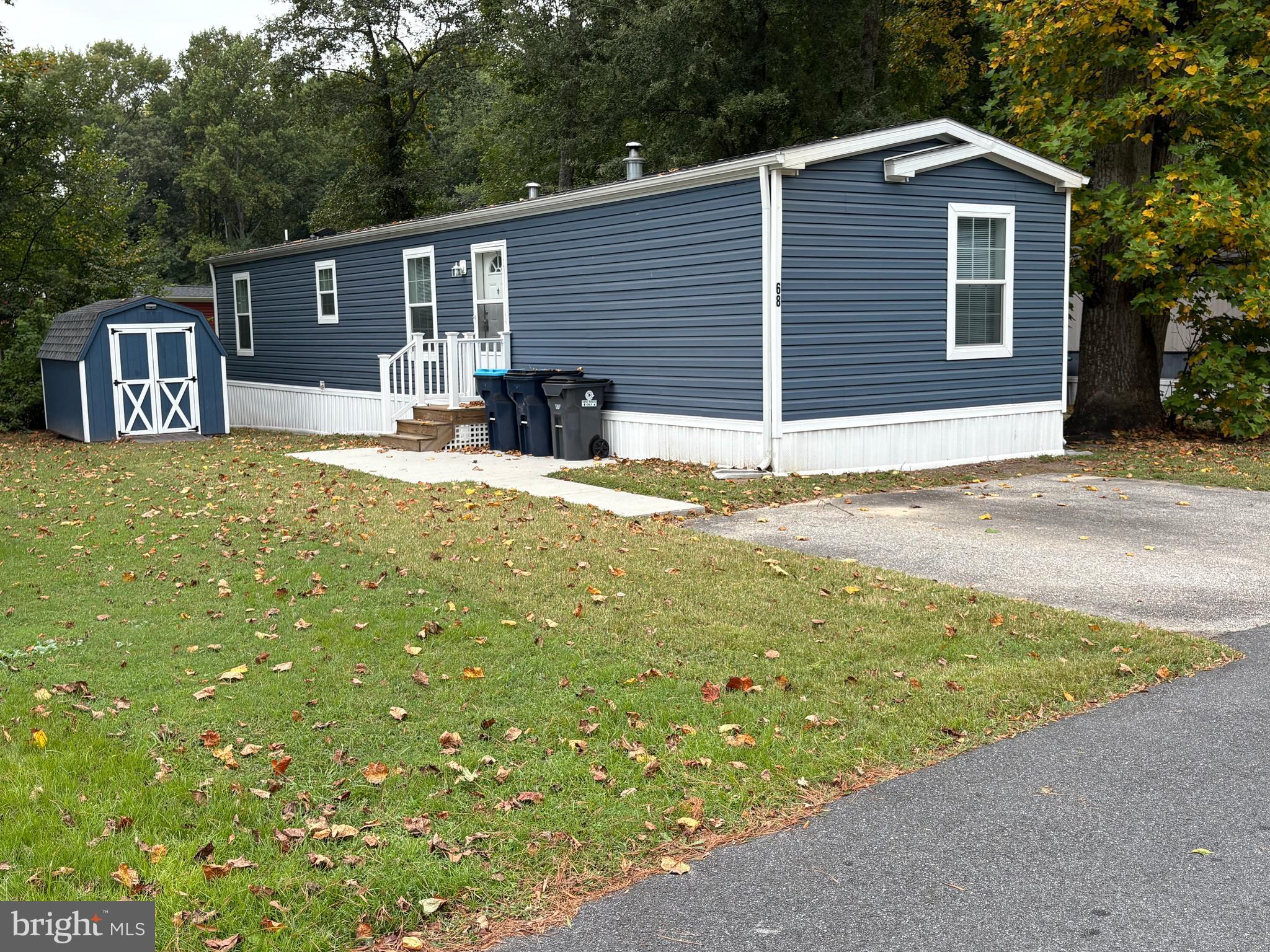 68 Friars Lane, Unit 68 Hartly, DE 19953 - Photo 2 of 18 a front view of a house with garden