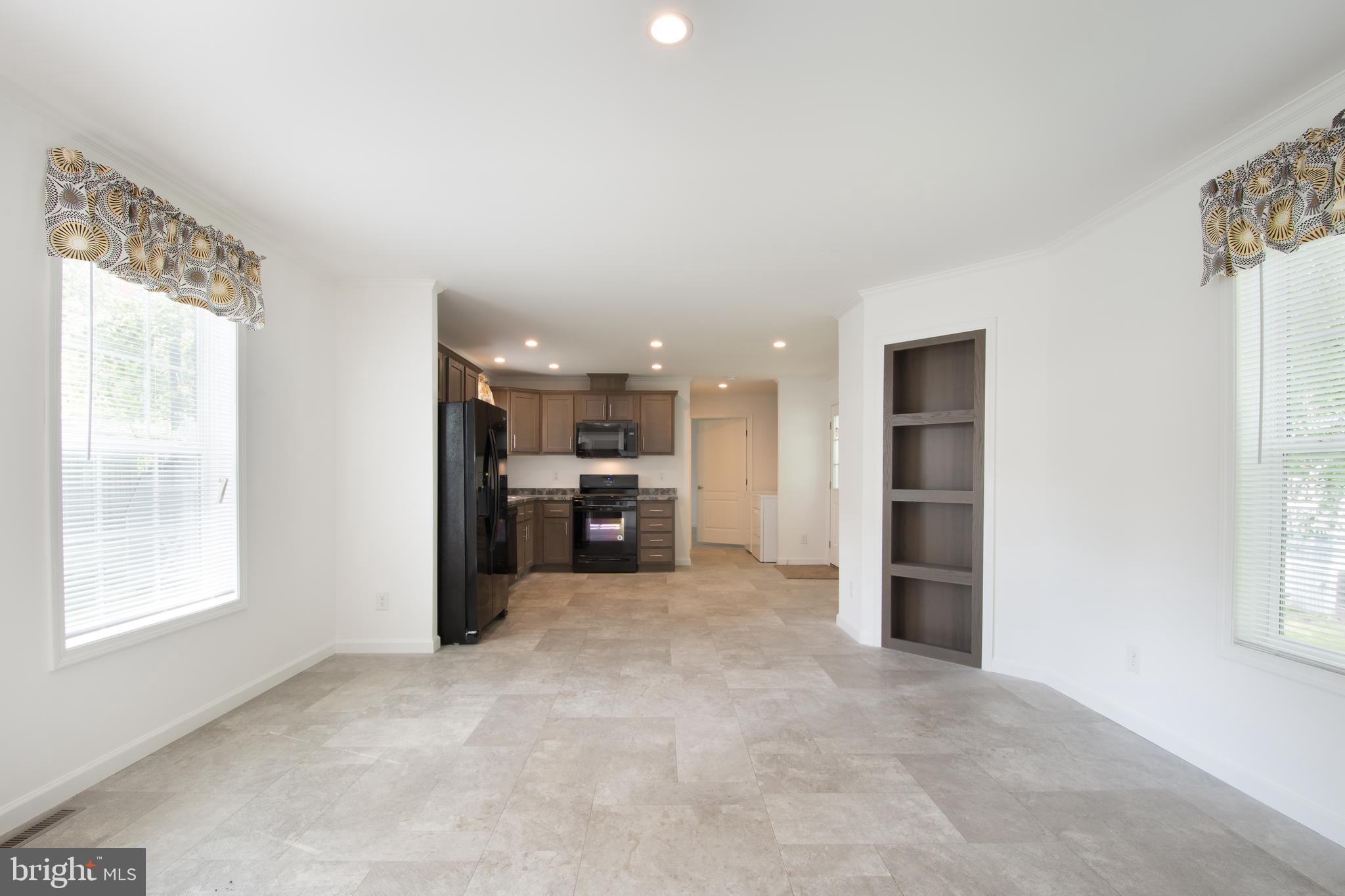 68 Friars Lane, Unit 68 Hartly, DE 19953 - Photo 10 of 18 a view of a kitchen with a sink and a window