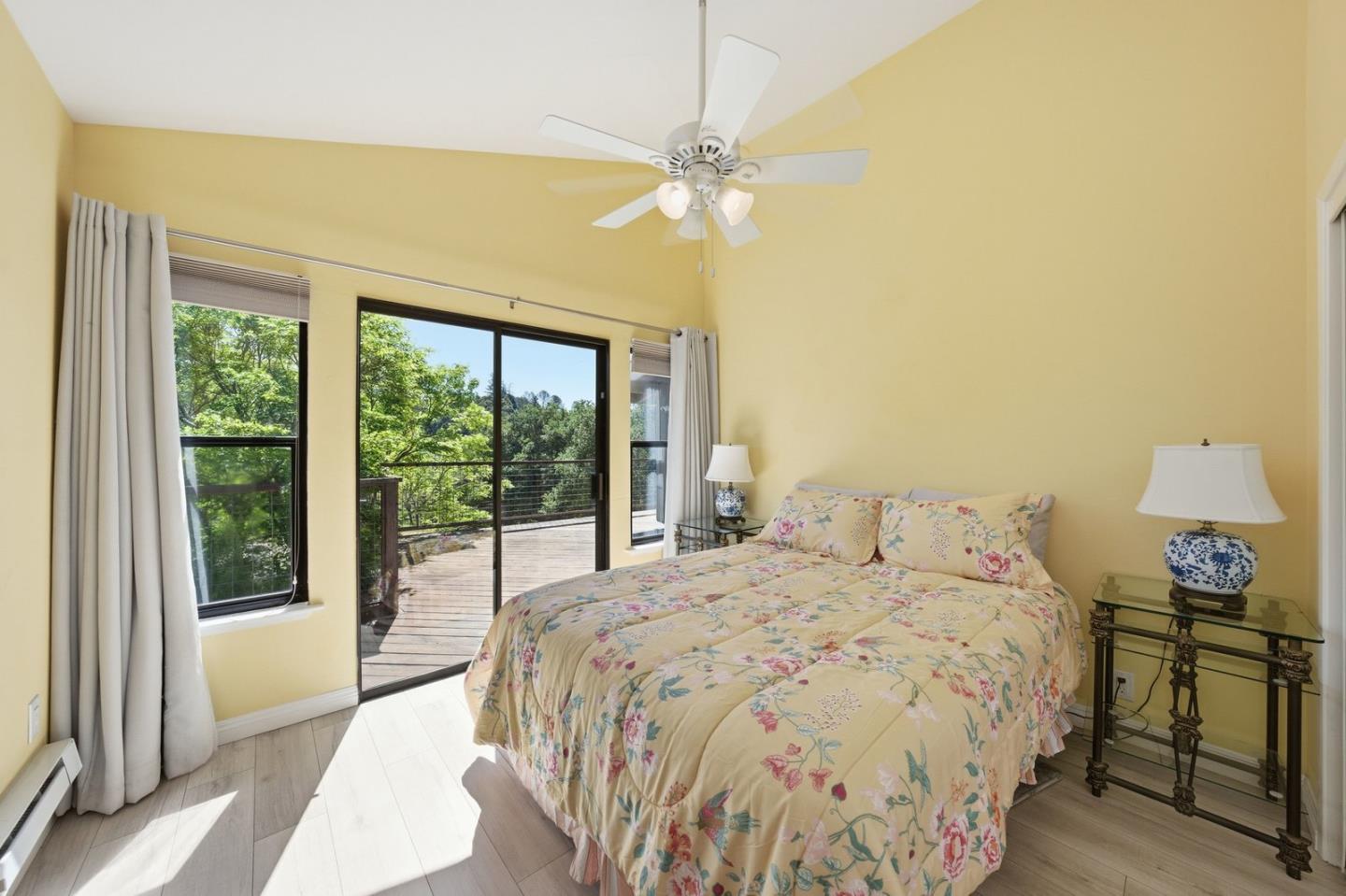 701 Day Valley Road Aptos, CA 95003 - Photo 32 of 43 a bedroom with a bed and a chandelier