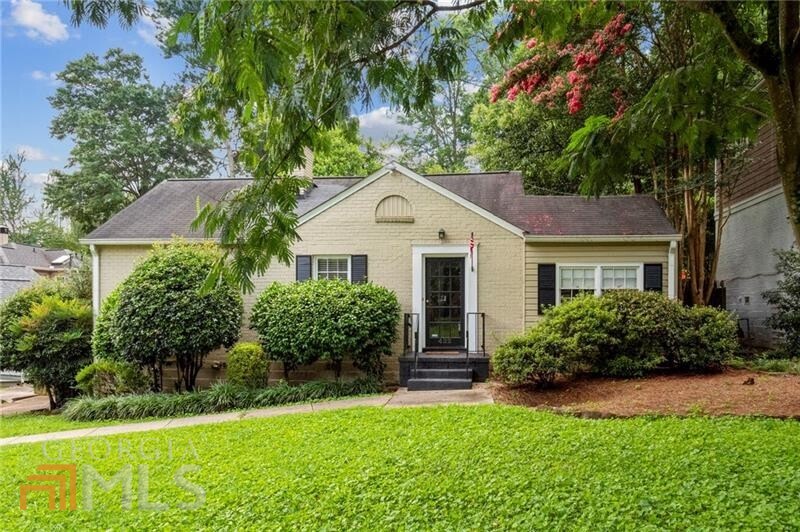 422 Hascall Road Northwest Atlanta, GA 30309 - Photo 1 of 1 a front view of a house with a yard