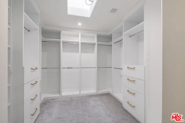 a view of an empty walk in closet