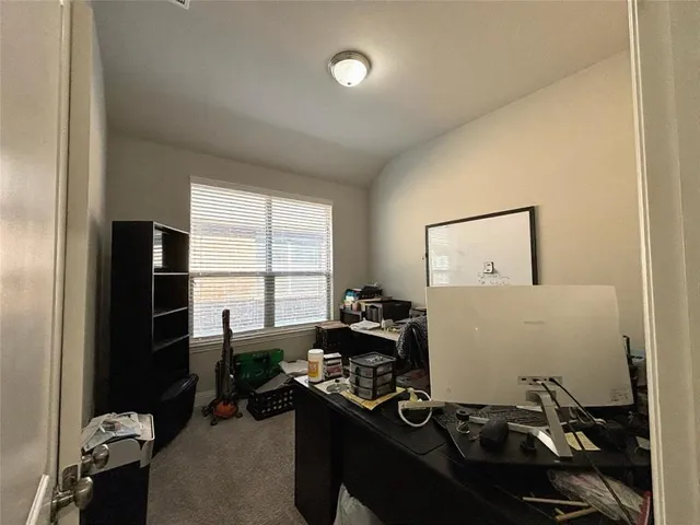 a room with furniture and a window