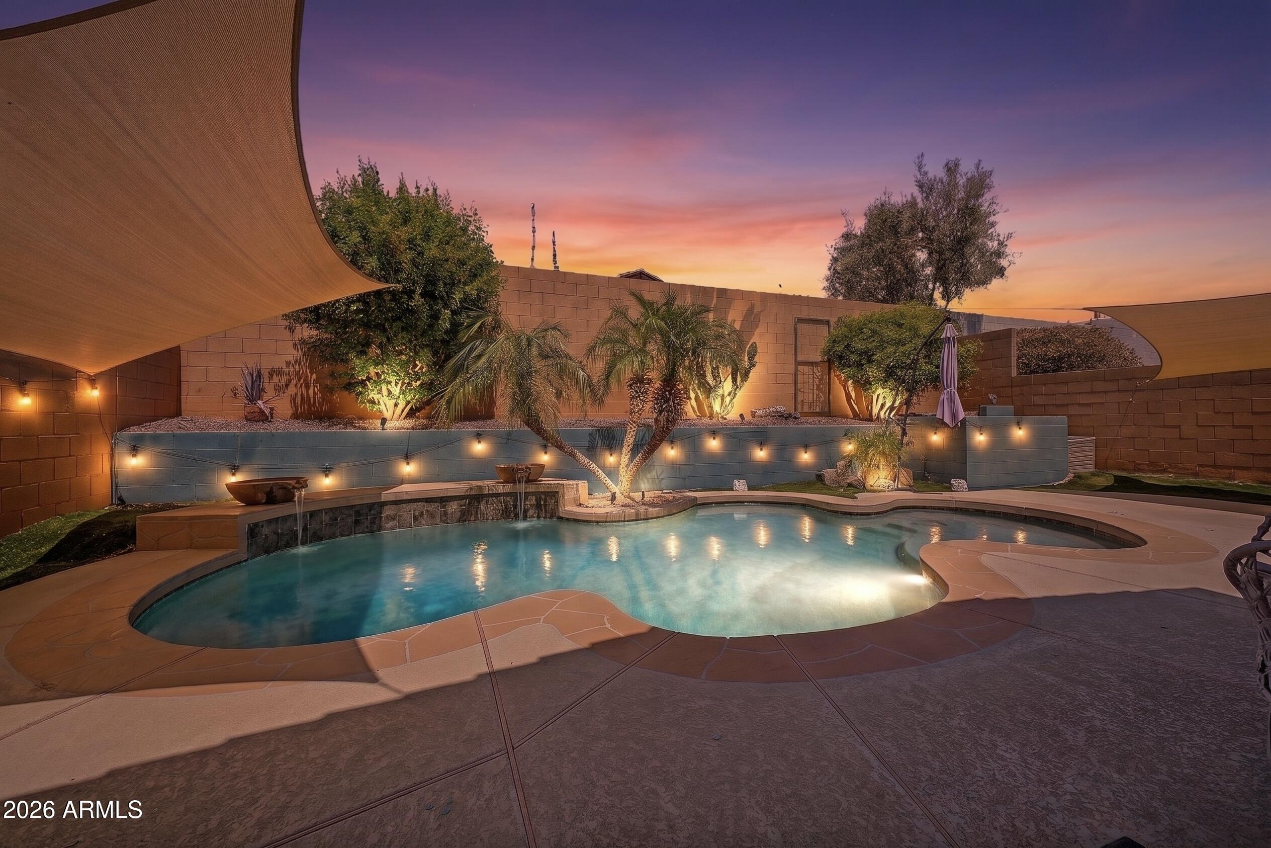 21052 West White Rock Road Buckeye, AZ 85396 - Photo 5 of 40 Backyard pool at sunset