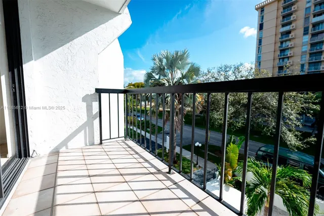 a view of balcony with wooden floor
