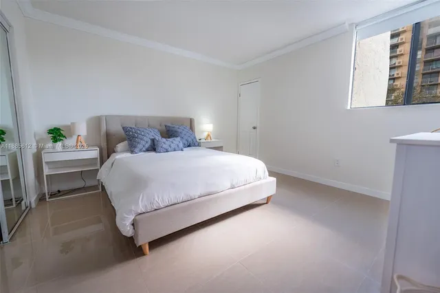 a bedroom with a bed and a cabinets