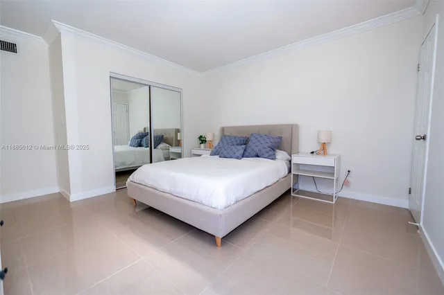 a bedroom with a bed and a table