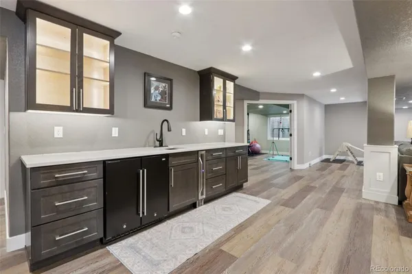 a large kitchen with kitchen island a sink stainless steel appliances and cabinets
