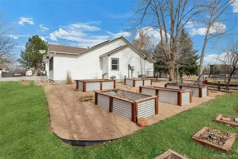 a view of a backyard with sitting area