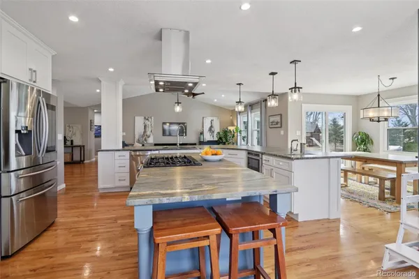 a view of kitchen and kitchen island with chair