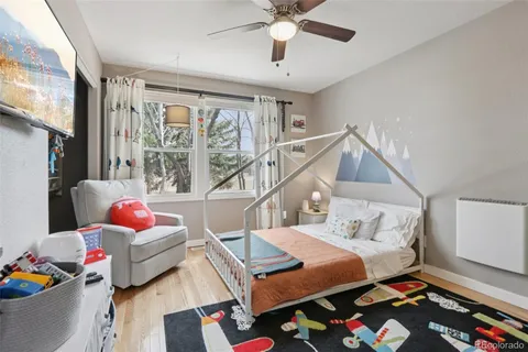 a bedroom with furniture and a window