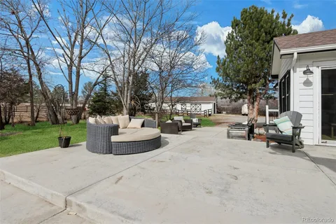 a view of a patio with couches and a fire pit