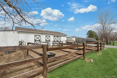 a view of a backyard with sitting area