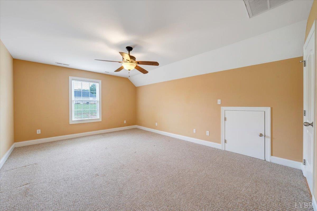 1250 Our Cove Road Huddleston, VA 24104 - Photo 35 of 70 a view of a big room with windows and chandelier fan