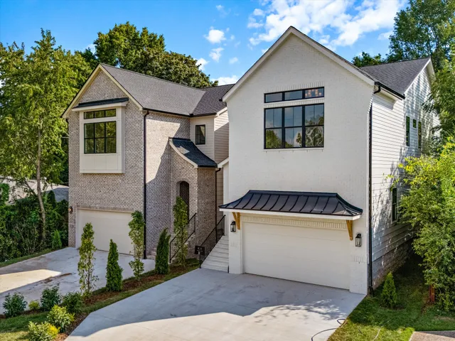 a kitchen with a dining table chairs and a chandelier