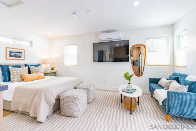 a bedroom with a bed and a dresser