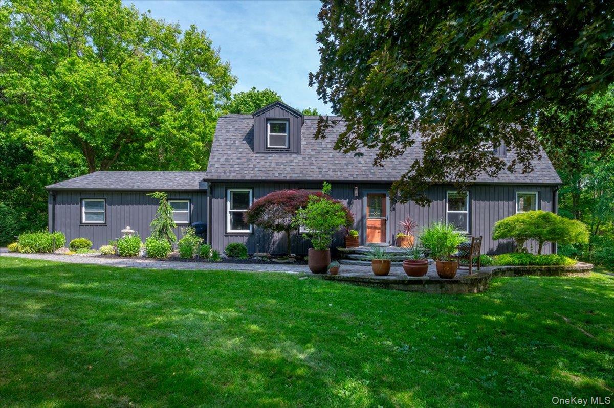 13 Jacks Pond Road Newburgh, NY 12550 - Photo 1 of 44 Classic Dutch Colonial -- dark-toned exterior with white trim windows.