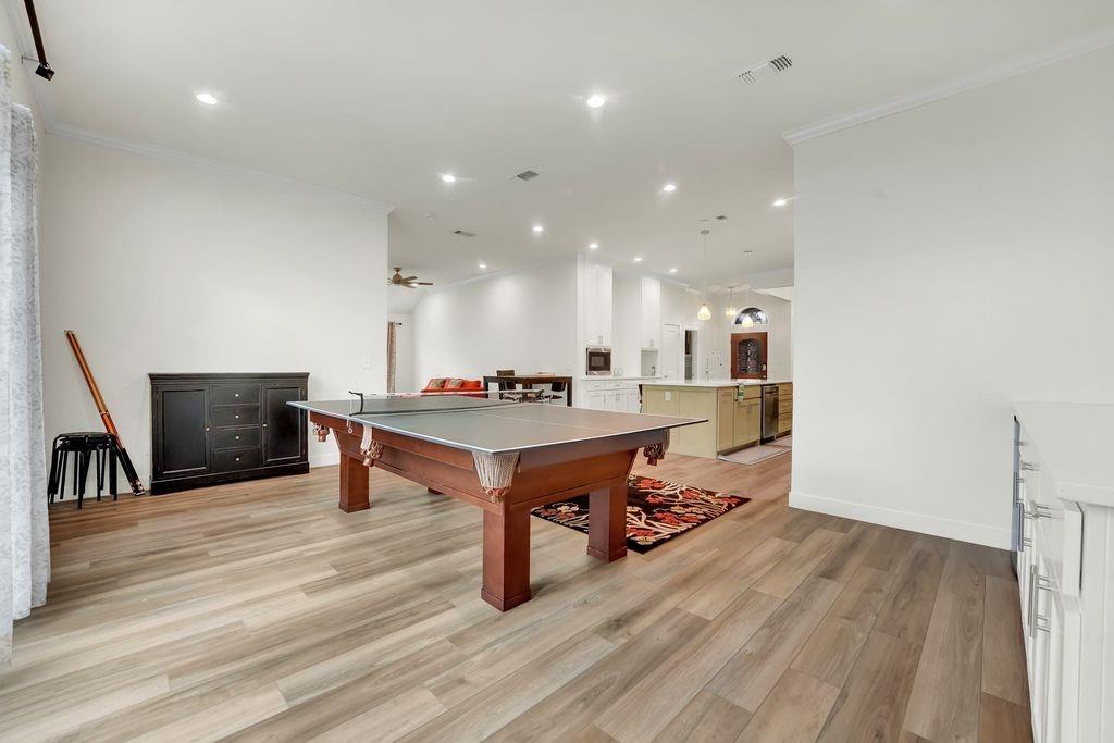 4035 Cedarview Road Dallas, TX 75287 - Photo 23 of 31 a living room with furniture and a table