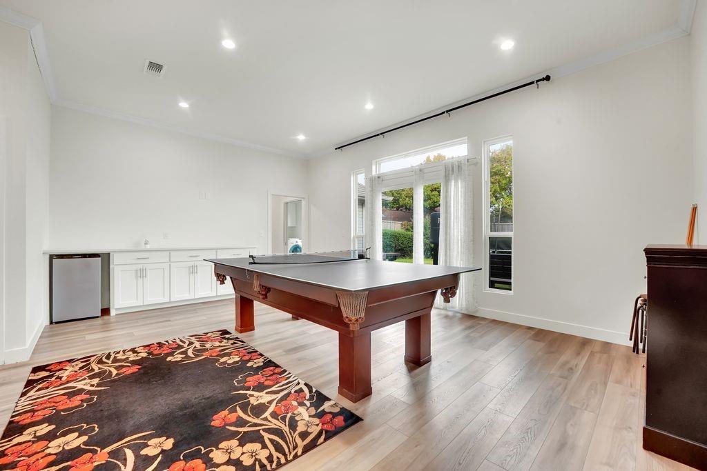4035 Cedarview Road Dallas, TX 75287 - Photo 24 of 31 a room with wooden floor and furniture