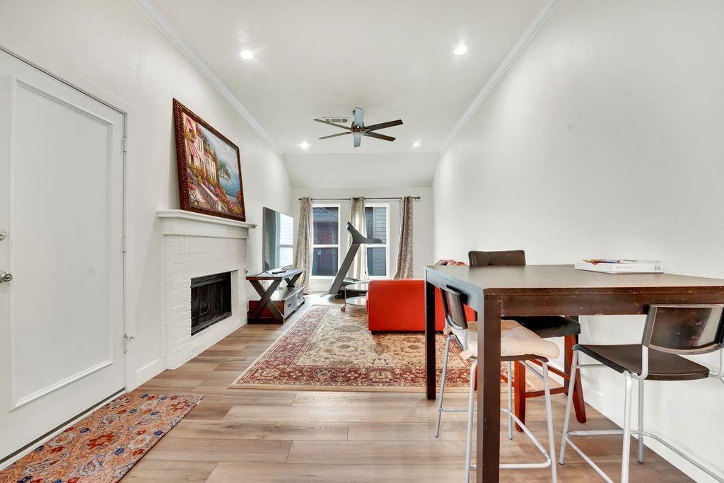 4035 Cedarview Road Dallas, TX 75287 - Photo 26 of 31 a living room with furniture a fireplace and a window